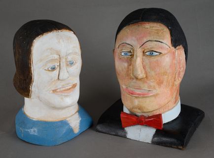 Two busts of a man and a woman