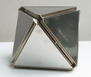 A silver, square pyramid