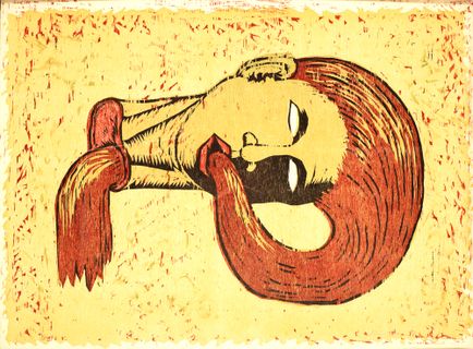 The head of a woman with red hair lying down 